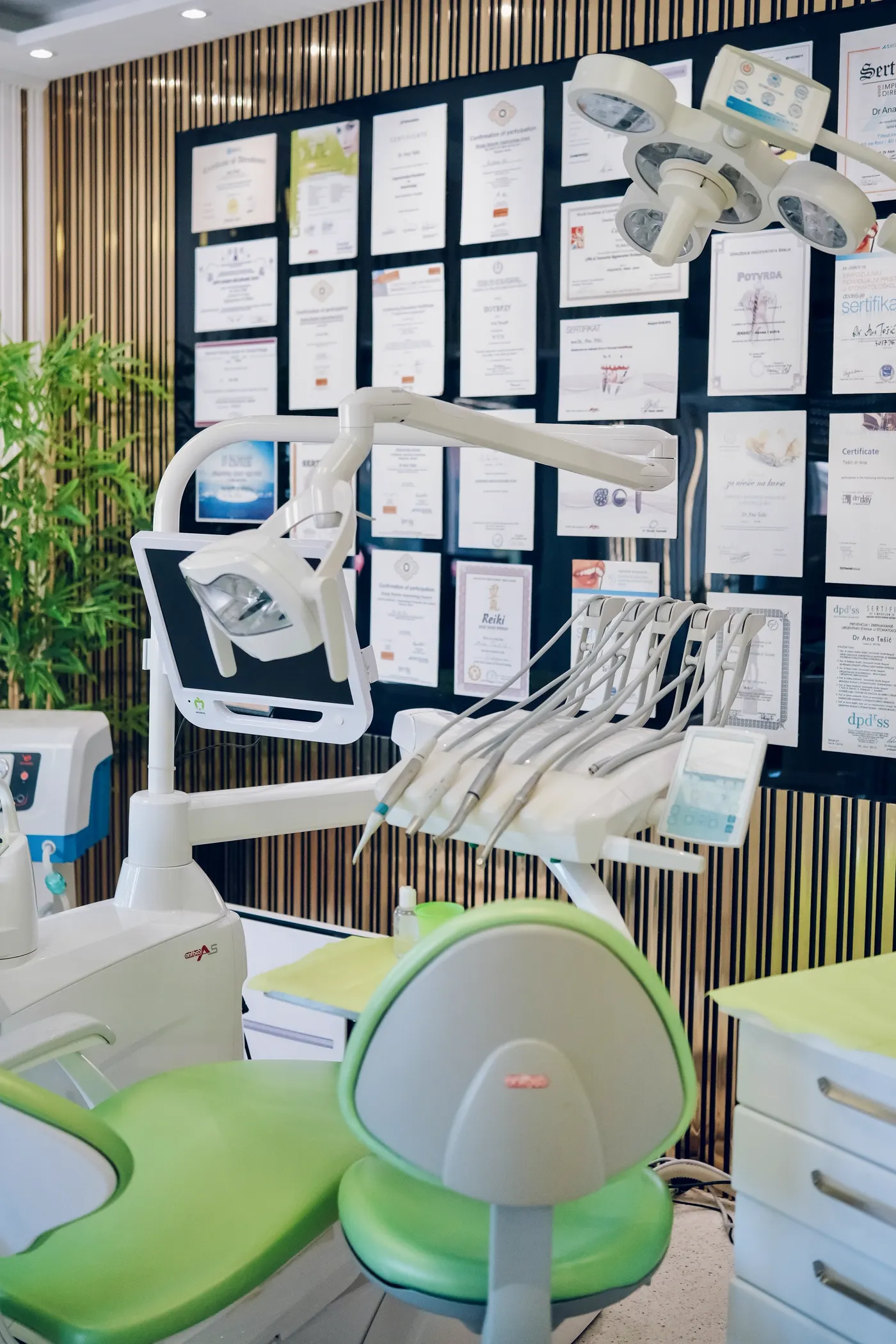 Treatment room and certificate wall at Aponia Dental Center